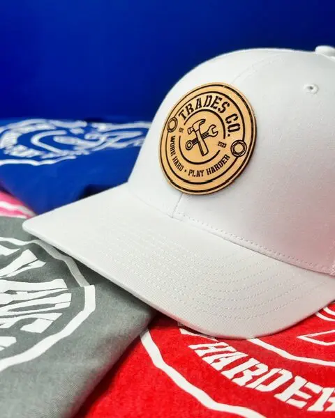 White hat with Trades Co Logo on front center.