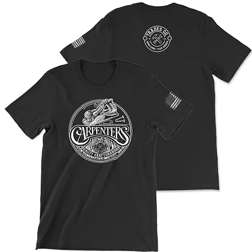 Black t-shirt with white circular design. Inside the circle is a wood planer at the top, "CARPENTERS" in script in the center with the trades co logo under that and "Quality Craftsmanship" at the bottom. Worn white American Flag on left sleeve. Small white Trades Co. Logo featured on the upper center back of the t-shirt.